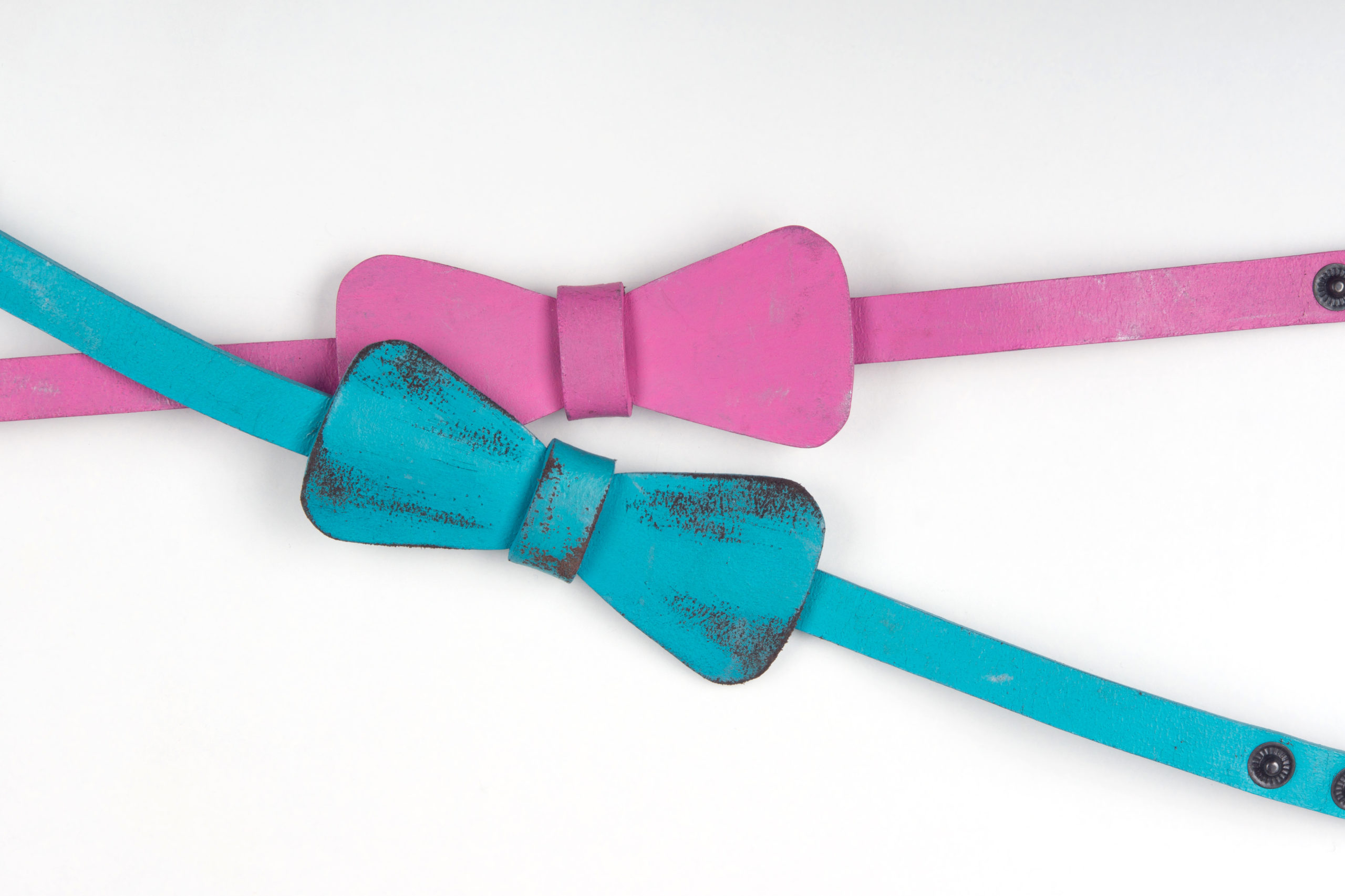 Blue and pink suede bow-ties give you a feeling of ease and lightness. Isolated on the white background